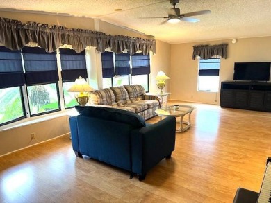 This stunning 2-bedroom, 2-bath, 1,456 sq. ft. home is perfectly on Crystal Lake Club in Florida - for sale on GolfHomes.com, golf home, golf lot