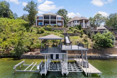 Nestled among the serene shores of Wilson Lake this magnificent on The Shoals Golf Club in Alabama - for sale on GolfHomes.com, golf home, golf lot