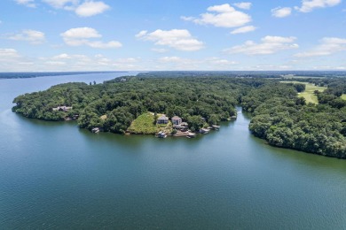 Nestled among the serene shores of Wilson Lake this magnificent on The Shoals Golf Club in Alabama - for sale on GolfHomes.com, golf home, golf lot