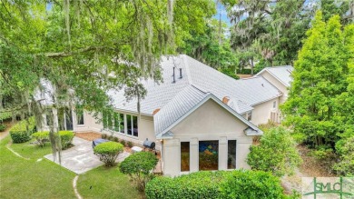 Large garage with full bonus above garage and full bath. Brick on The Landings Club - Palmetto in Georgia - for sale on GolfHomes.com, golf home, golf lot