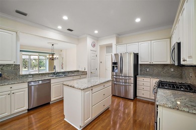 OUTSTANDING GOLF FRONT CUSTOM GRANVILLE IN WINDWARD HILLS WITH on Eagle Ridge At Spruce Creek Country Club in Florida - for sale on GolfHomes.com, golf home, golf lot