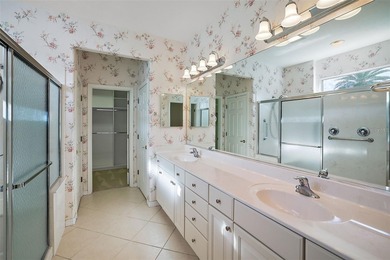 OUTSTANDING GOLF FRONT CUSTOM GRANVILLE IN WINDWARD HILLS WITH on Eagle Ridge At Spruce Creek Country Club in Florida - for sale on GolfHomes.com, golf home, golf lot