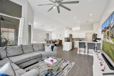 ENJOY LIVING & RELAXING IN THIS GORGEOUS REMODELED HOME WITH on Woodmont Country Club in Florida - for sale on GolfHomes.com, golf home, golf lot