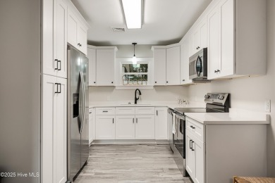 Renovated home with 2 Screened porches!  Enjoy this single-story on Founders Club At St. James Plantation in North Carolina - for sale on GolfHomes.com, golf home, golf lot
