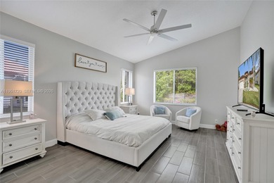 ENJOY LIVING & RELAXING IN THIS GORGEOUS REMODELED HOME WITH on Woodmont Country Club in Florida - for sale on GolfHomes.com, golf home, golf lot