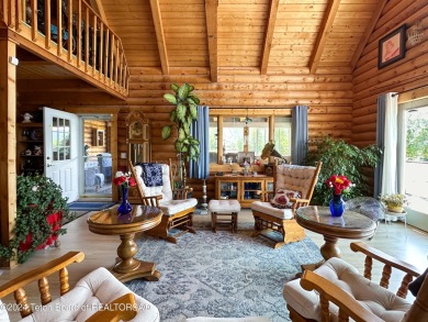 This expansive 5 bed, 3 bath log home offers a perfect blend of on Cedar Creek Golf Course in Wyoming - for sale on GolfHomes.com, golf home, golf lot