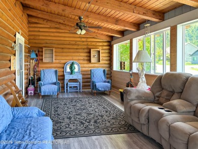 This expansive 5 bed, 3 bath log home offers a perfect blend of on Cedar Creek Golf Course in Wyoming - for sale on GolfHomes.com, golf home, golf lot