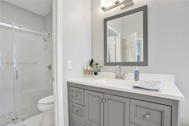 ENJOY LIVING & RELAXING IN THIS GORGEOUS REMODELED HOME WITH on Woodmont Country Club in Florida - for sale on GolfHomes.com, golf home, golf lot