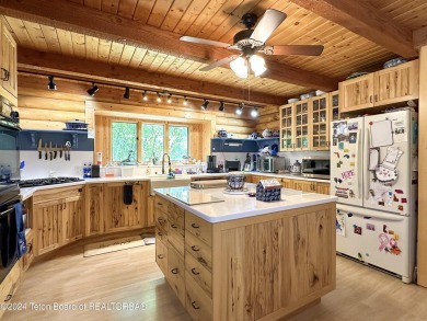 This expansive 5 bed, 3 bath log home offers a perfect blend of on Cedar Creek Golf Course in Wyoming - for sale on GolfHomes.com, golf home, golf lot