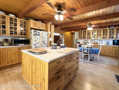 This expansive 5 bed, 3 bath log home offers a perfect blend of on Cedar Creek Golf Course in Wyoming - for sale on GolfHomes.com, golf home, golf lot