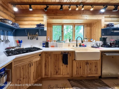 This expansive 5 bed, 3 bath log home offers a perfect blend of on Cedar Creek Golf Course in Wyoming - for sale on GolfHomes.com, golf home, golf lot