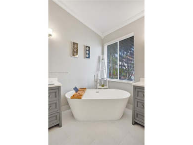 ENJOY LIVING & RELAXING IN THIS GORGEOUS REMODELED HOME WITH on Woodmont Country Club in Florida - for sale on GolfHomes.com, golf home, golf lot