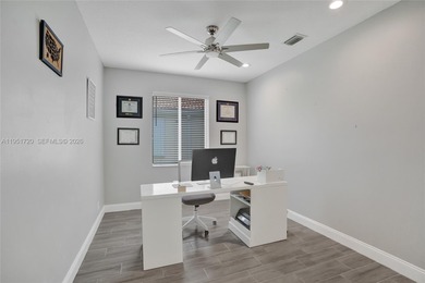 ENJOY LIVING & RELAXING IN THIS GORGEOUS REMODELED HOME WITH on Woodmont Country Club in Florida - for sale on GolfHomes.com, golf home, golf lot