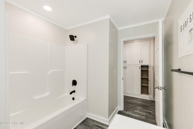 Renovated home with 2 Screened porches!  Enjoy this single-story on Founders Club At St. James Plantation in North Carolina - for sale on GolfHomes.com, golf home, golf lot