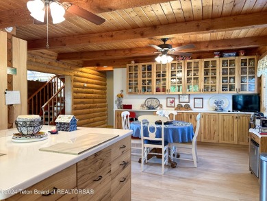 This expansive 5 bed, 3 bath log home offers a perfect blend of on Cedar Creek Golf Course in Wyoming - for sale on GolfHomes.com, golf home, golf lot