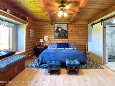 This expansive 5 bed, 3 bath log home offers a perfect blend of on Cedar Creek Golf Course in Wyoming - for sale on GolfHomes.com, golf home, golf lot