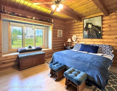 This expansive 5 bed, 3 bath log home offers a perfect blend of on Cedar Creek Golf Course in Wyoming - for sale on GolfHomes.com, golf home, golf lot