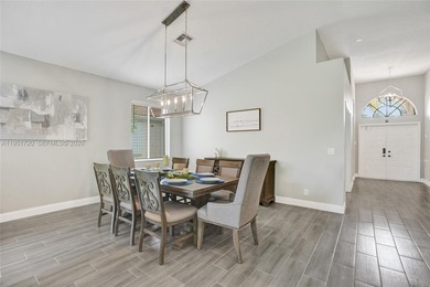 ENJOY LIVING & RELAXING IN THIS GORGEOUS REMODELED HOME WITH on Woodmont Country Club in Florida - for sale on GolfHomes.com, golf home, golf lot