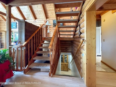 This expansive 5 bed, 3 bath log home offers a perfect blend of on Cedar Creek Golf Course in Wyoming - for sale on GolfHomes.com, golf home, golf lot