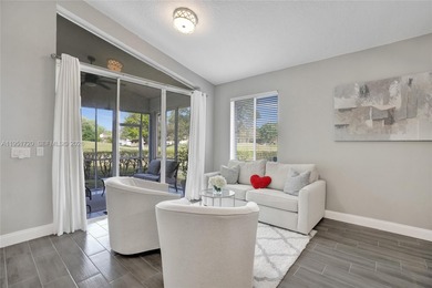 ENJOY LIVING & RELAXING IN THIS GORGEOUS REMODELED HOME WITH on Woodmont Country Club in Florida - for sale on GolfHomes.com, golf home, golf lot