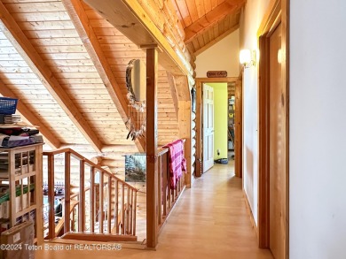 This expansive 5 bed, 3 bath log home offers a perfect blend of on Cedar Creek Golf Course in Wyoming - for sale on GolfHomes.com, golf home, golf lot