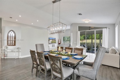 ENJOY LIVING & RELAXING IN THIS GORGEOUS REMODELED HOME WITH on Woodmont Country Club in Florida - for sale on GolfHomes.com, golf home, golf lot