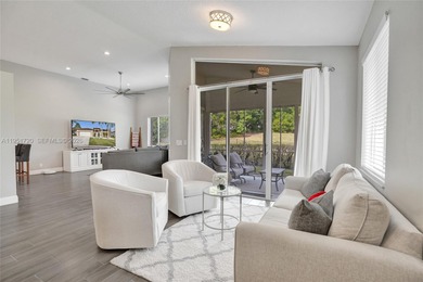 ENJOY LIVING & RELAXING IN THIS GORGEOUS REMODELED HOME WITH on Woodmont Country Club in Florida - for sale on GolfHomes.com, golf home, golf lot