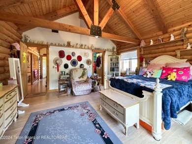 This expansive 5 bed, 3 bath log home offers a perfect blend of on Cedar Creek Golf Course in Wyoming - for sale on GolfHomes.com, golf home, golf lot