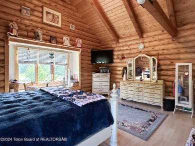 This expansive 5 bed, 3 bath log home offers a perfect blend of on Cedar Creek Golf Course in Wyoming - for sale on GolfHomes.com, golf home, golf lot