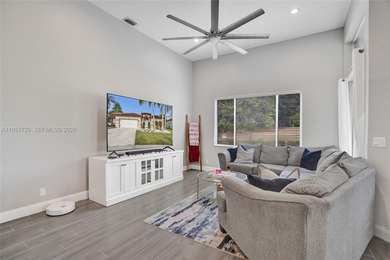 ENJOY LIVING & RELAXING IN THIS GORGEOUS REMODELED HOME WITH on Woodmont Country Club in Florida - for sale on GolfHomes.com, golf home, golf lot