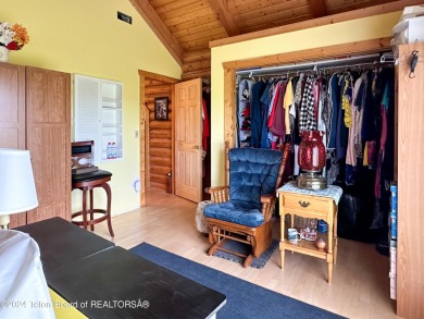 This expansive 5 bed, 3 bath log home offers a perfect blend of on Cedar Creek Golf Course in Wyoming - for sale on GolfHomes.com, golf home, golf lot