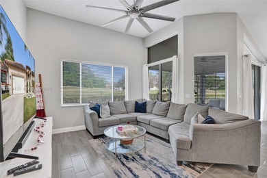 ENJOY LIVING & RELAXING IN THIS GORGEOUS REMODELED HOME WITH on Woodmont Country Club in Florida - for sale on GolfHomes.com, golf home, golf lot