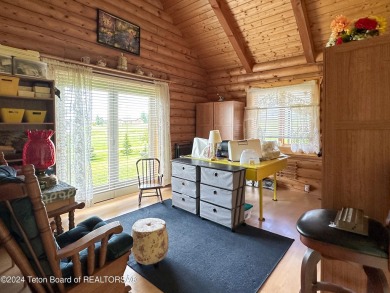 This expansive 5 bed, 3 bath log home offers a perfect blend of on Cedar Creek Golf Course in Wyoming - for sale on GolfHomes.com, golf home, golf lot