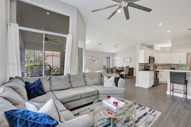 ENJOY LIVING & RELAXING IN THIS GORGEOUS REMODELED HOME WITH on Woodmont Country Club in Florida - for sale on GolfHomes.com, golf home, golf lot