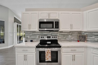 ENJOY LIVING & RELAXING IN THIS GORGEOUS REMODELED HOME WITH on Woodmont Country Club in Florida - for sale on GolfHomes.com, golf home, golf lot