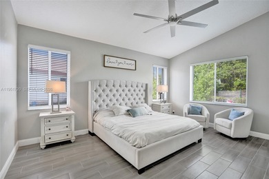 ENJOY LIVING & RELAXING IN THIS GORGEOUS REMODELED HOME WITH on Woodmont Country Club in Florida - for sale on GolfHomes.com, golf home, golf lot