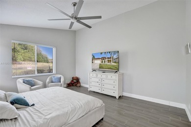 ENJOY LIVING & RELAXING IN THIS GORGEOUS REMODELED HOME WITH on Woodmont Country Club in Florida - for sale on GolfHomes.com, golf home, golf lot