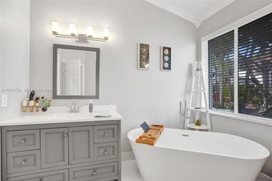 ENJOY LIVING & RELAXING IN THIS GORGEOUS REMODELED HOME WITH on Woodmont Country Club in Florida - for sale on GolfHomes.com, golf home, golf lot