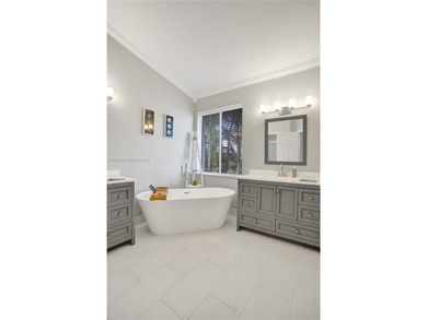 ENJOY LIVING & RELAXING IN THIS GORGEOUS REMODELED HOME WITH on Woodmont Country Club in Florida - for sale on GolfHomes.com, golf home, golf lot