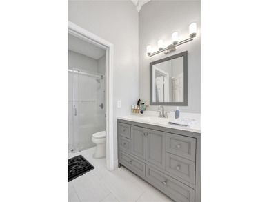 ENJOY LIVING & RELAXING IN THIS GORGEOUS REMODELED HOME WITH on Woodmont Country Club in Florida - for sale on GolfHomes.com, golf home, golf lot