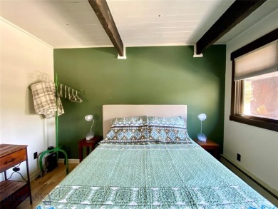 Charming and well-maintained end-unit condo featuring a cozy on Big Sky of Montana Golf Course in Montana - for sale on GolfHomes.com, golf home, golf lot