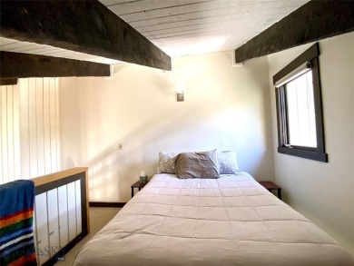 Charming and well-maintained end-unit condo featuring a cozy on Big Sky of Montana Golf Course in Montana - for sale on GolfHomes.com, golf home, golf lot