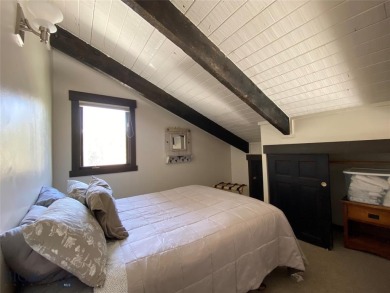 Charming and well-maintained end-unit condo featuring a cozy on Big Sky of Montana Golf Course in Montana - for sale on GolfHomes.com, golf home, golf lot