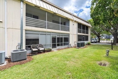 Located in the heart of Palm Beach Gardens, this charming on BallenIsles Golf and Country Club in Florida - for sale on GolfHomes.com, golf home, golf lot