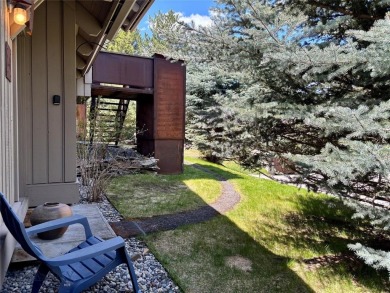 Charming and well-maintained end-unit condo featuring a cozy on Big Sky of Montana Golf Course in Montana - for sale on GolfHomes.com, golf home, golf lot