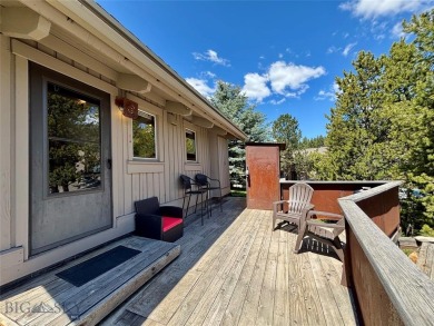 Charming and well-maintained end-unit condo featuring a cozy on Big Sky of Montana Golf Course in Montana - for sale on GolfHomes.com, golf home, golf lot