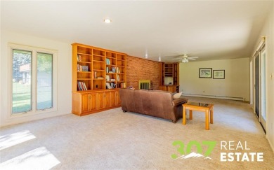 Set on .55 acres along the 16th hole of Olive Glenn Golf Course on Olive Glenn Golf and Country Club in Wyoming - for sale on GolfHomes.com, golf home, golf lot