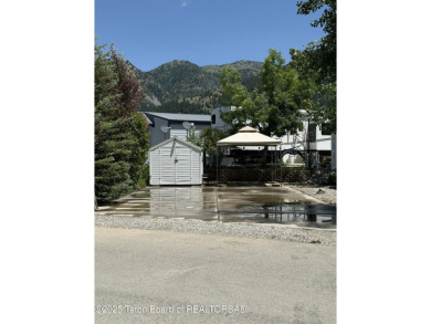 Great RV Pad with mature landscaping, Mountain views,  concrete on Star Valley RV Golf Course in Wyoming - for sale on GolfHomes.com, golf home, golf lot