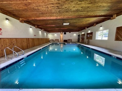 Charming and well-maintained end-unit condo featuring a cozy on Big Sky of Montana Golf Course in Montana - for sale on GolfHomes.com, golf home, golf lot
