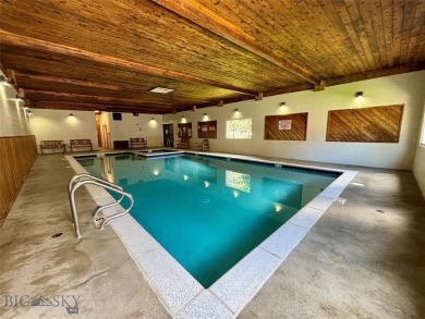 Charming and well-maintained end-unit condo featuring a cozy on Big Sky of Montana Golf Course in Montana - for sale on GolfHomes.com, golf home, golf lot
